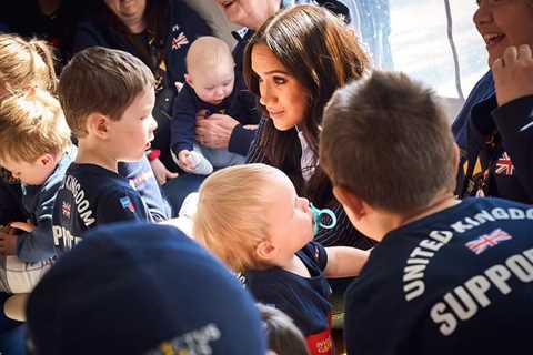 Meghan Markle grins as she plays with babies in unseen pictures – after admitting she misses Archie ..