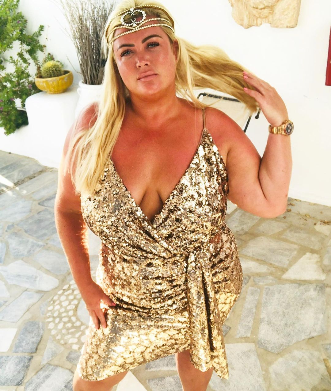 Gemma Collins looks slimmer than ever as she shows cleavage in figure-hugging gold dress
