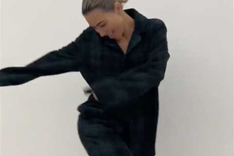 Kim Kardashian’s thin frame nearly drowns in oversized pajamas while showing off wild dance moves..