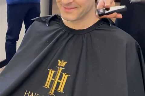 Pop singer looks unrecognisable as he shaves off famous curls before having hair transplant