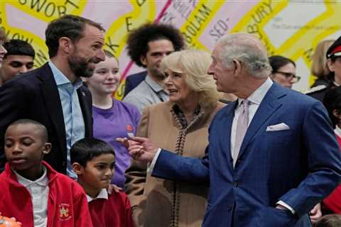 King Charles has a kickabout with a passing football – as he greets England boss Gareth Southgate