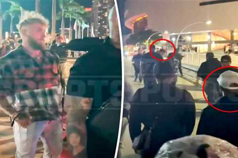 Jake Paul runs away from Floyd Mayweather in confrontation at Heat game