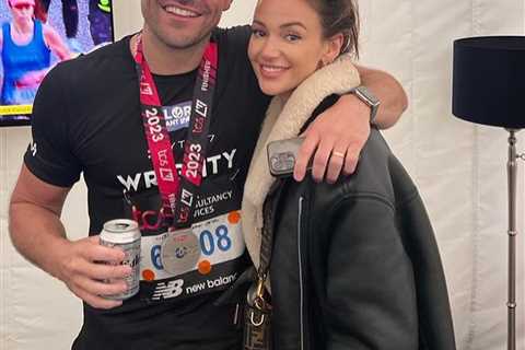 Michelle Keegan so proud as she celebrates with husband Mark Wright at the London Marathon finish..