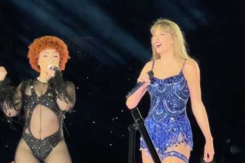 Ice Spice Performs in Black Custom Theophilio Feathered Catsuit for Taylor Swift’s Eras Tour
