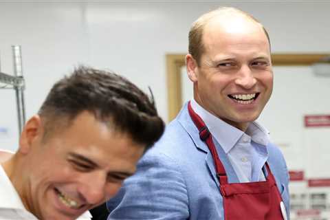 Prince William laughs as he carries out Royal duties – 100 miles from his brother as Harry returns..