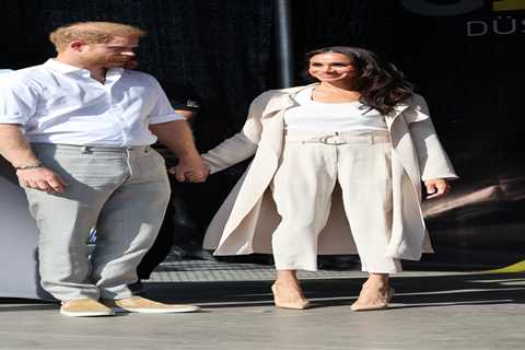 Meghan Markle and Prince Harry hold hands as they appear for last day of Invictus Games