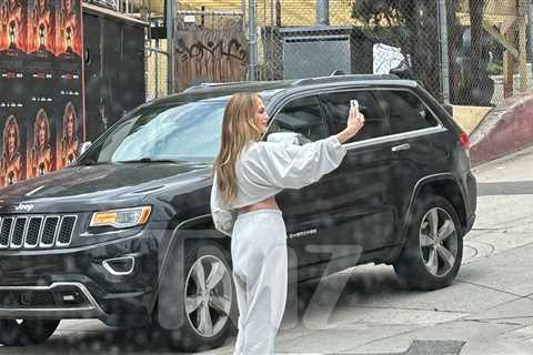Jennifer Lopez Takes Selfies in Front of Her Own 'Atlas' Billboard