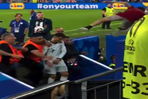 Cristiano Ronaldo narrowly misses being struck by flying fan in wild  Euro 2024 scene