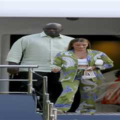 Michael Jordan holds hands with wife Yvette Prieto after departing his $115 million yacht in..