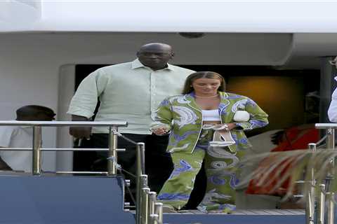 Michael Jordan holds hands with wife Yvette Prieto after departing his $115 million yacht in..