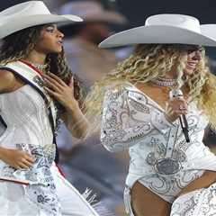 Beyonce Wears Custom Roberto Cavalli Couture White Feather Look and an ASN Cowboy Hat while Blue..