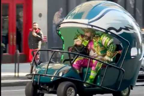 Jason Kelce flips over while driving Eagles helmet cart in wild video