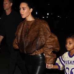 Kim Kardashian Stepped Out with her Son Psalm West in a Brown Fur Bomber Jacket with Black Leather..