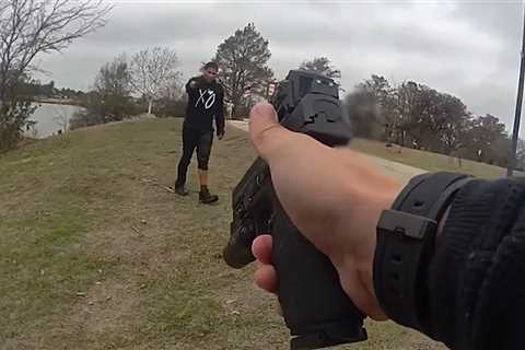 Police Officer Begs Man to Put Down Knife After He Climbs Out of Car in Lake, on Video