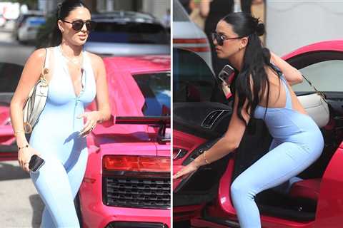 Camilla Araujo Shows Off Tight Spandex Bodysuit and Pink Audi