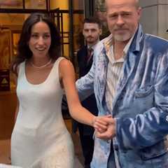 Brad Pitt Wears Blue Velvet Willy Chavarria Blazer as Ines de Ramon Stuns in Ivory Silk Boucle..