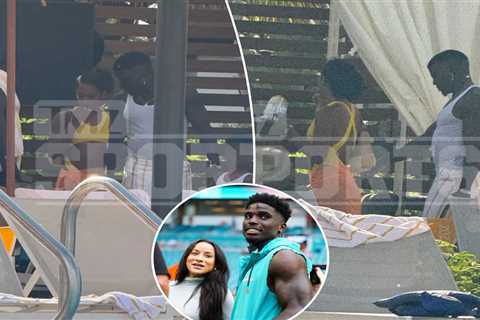 Tyreek Hill gets flirty with mystery woman in pool after wife’s divorce filing