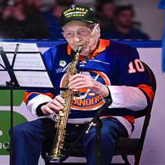 WWII vet, 104, thrills Rangers-Islanders crowd with national anthem on saxophone as fans unite for..