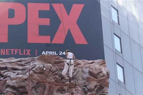 Charlize Theron Climbs the Walls of Times Square to Promote New Movie 'Apex'