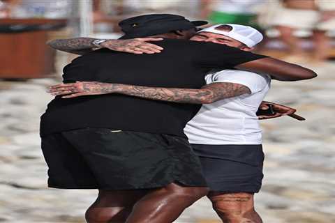 Michael Jordan hugs David Beckham during luxurious Ibiza vacation with their wives